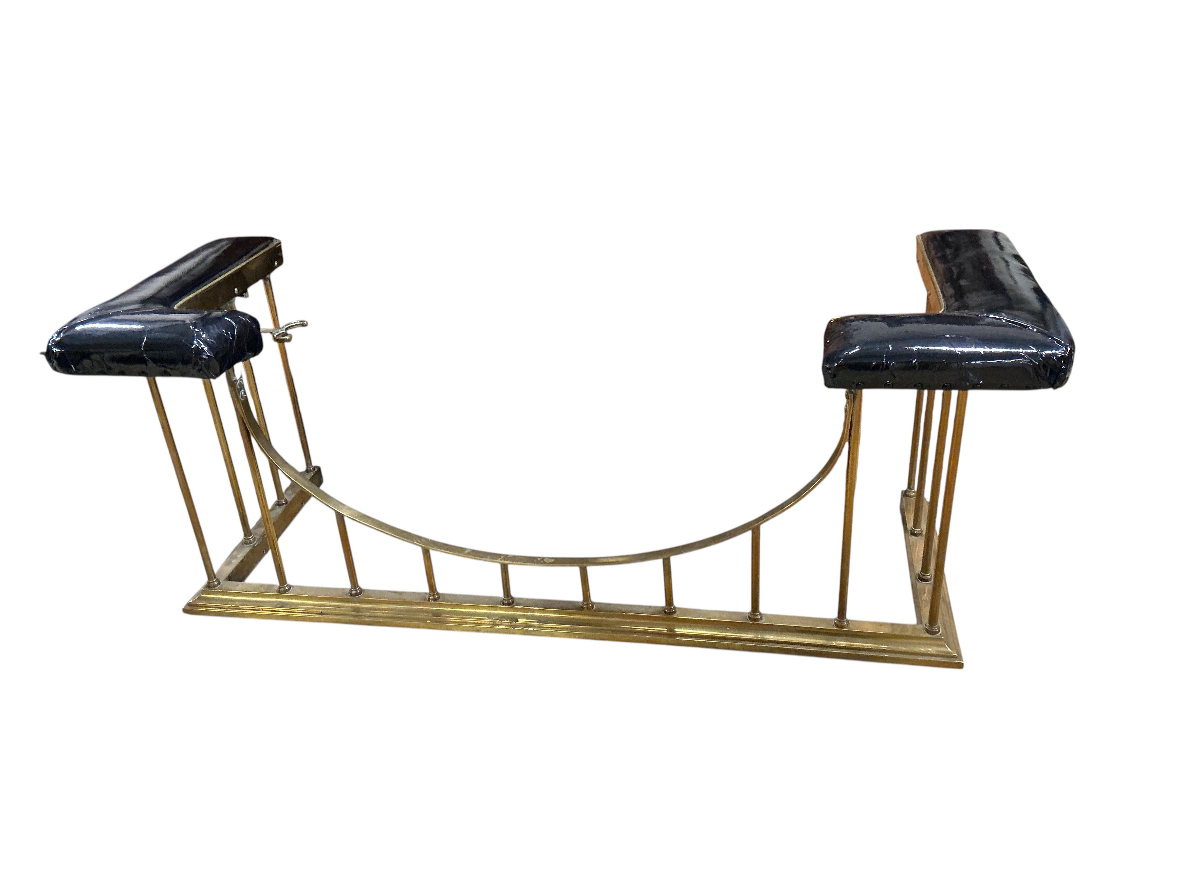 A late Victorian brass club fender, in need of re-upholstering, width 160cm, depth 60cm, height 59cm